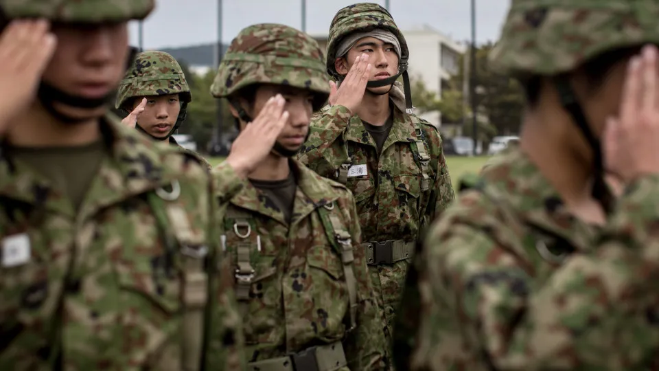 What is the meaning behind the military salute?